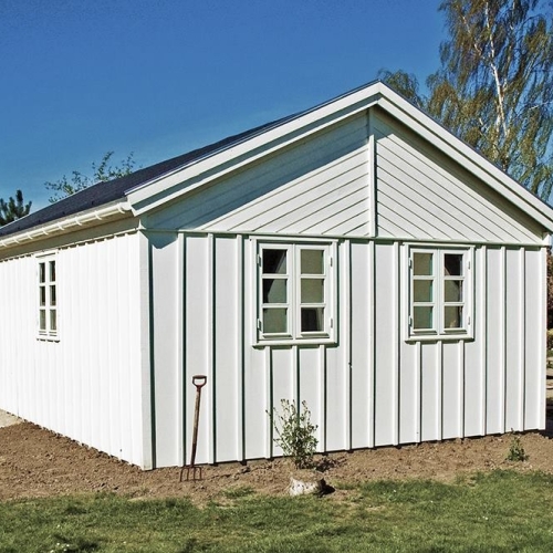 Moderne tilbygning til villa i Vig af holdbare materialer